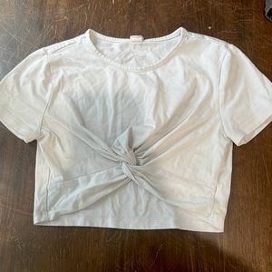 It is a white tied crop top size 11-12